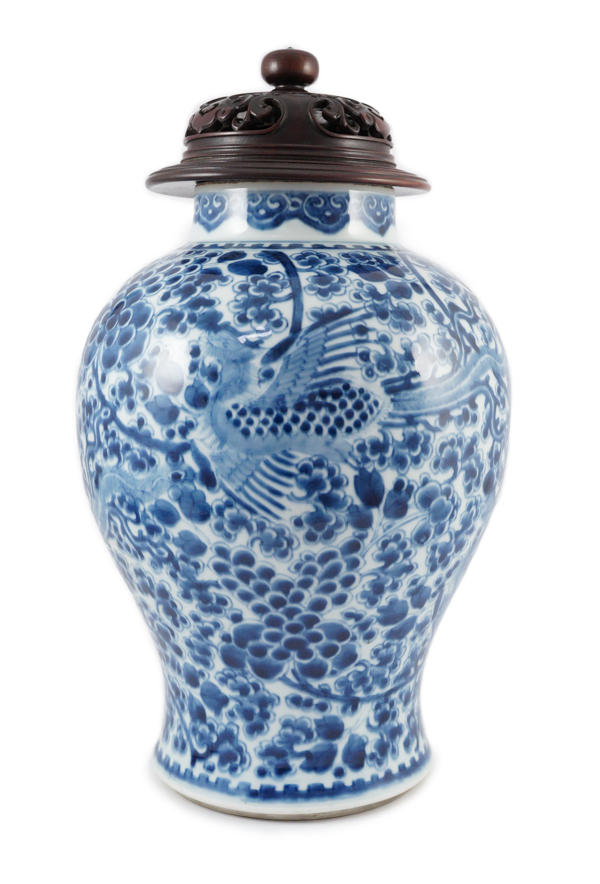A Chinese blue and white ‘phoenix and peony’ baluster jar, Kangxi period, with a later wood cover, 36cm high excluding later wood cover